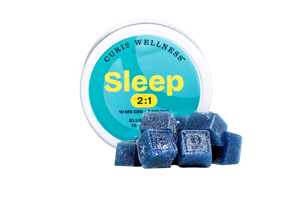 Curio Wellness Sleep 2:1 infused gummies displayed in front of the product container, showing glossy blue square gummies designed for nighttime use.