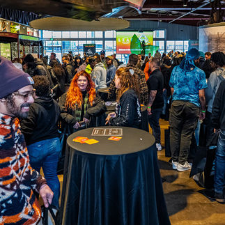 Booth scene with a vibrant crowd, industry reps, and branding materials being exchanged at Maryland Leaf Bowl 2025.