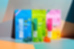 A vibrant display of colorful Incredibles Gummies packages with gummy pieces in front, showcasing various flavors and THC-CBD combinations.