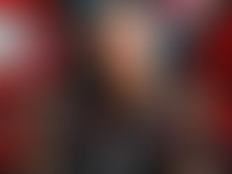 Punk style model with blue mohawk holding High Wired infused cannabis jar and lit pre-roll, edgy industrial aesthetic