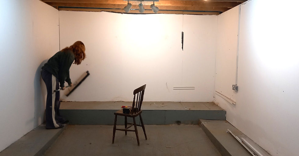 Gabby takes the broom approach - sweeping away cobwebs prior to painting...