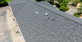 Mid Day Drone Images of Commercial Roofs Featuring TPO and Asphalt Shingles Strip Mall, Su