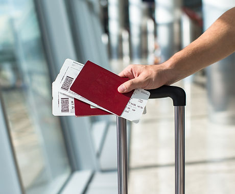 Closeup of man holding passports and boa