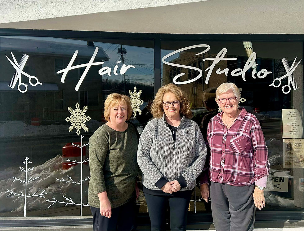 Three women from the Hair Studio standing together, including two stylists and the owner-operator, featured in a blog about nearly four decades of community, care, and change at 65 West Main.