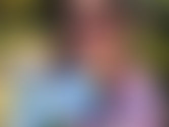 Hannah Langdon reading a copy of Summer at Tillingford Hall