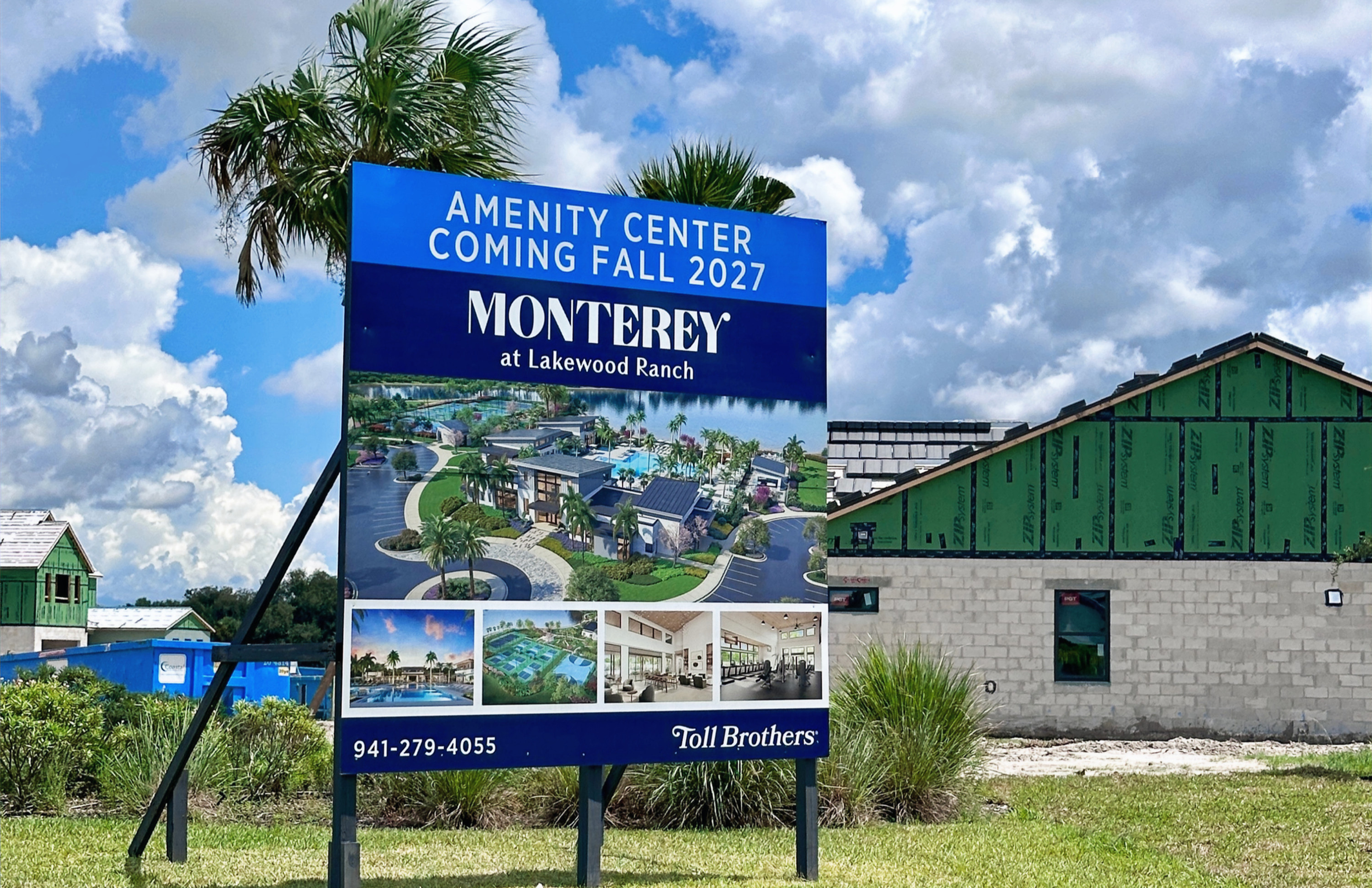 Blue sign for Monterey at Lakewood Ranch says Amenity Center Coming Fall 2027, beside new home construction under cloudy sky.