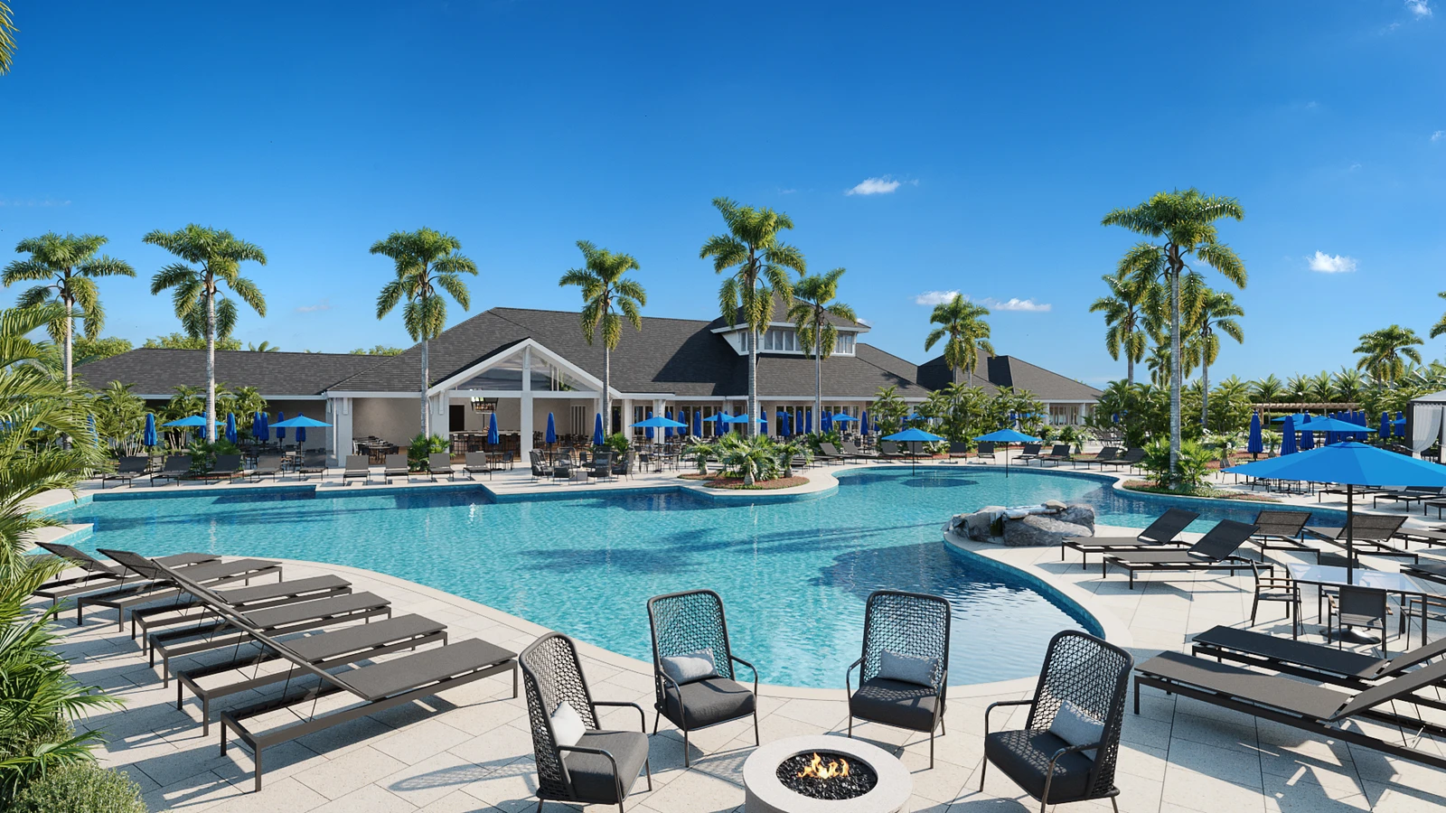 Tropical resort-style pool surrounded by palm trees, seating areas, and a fire pit.
