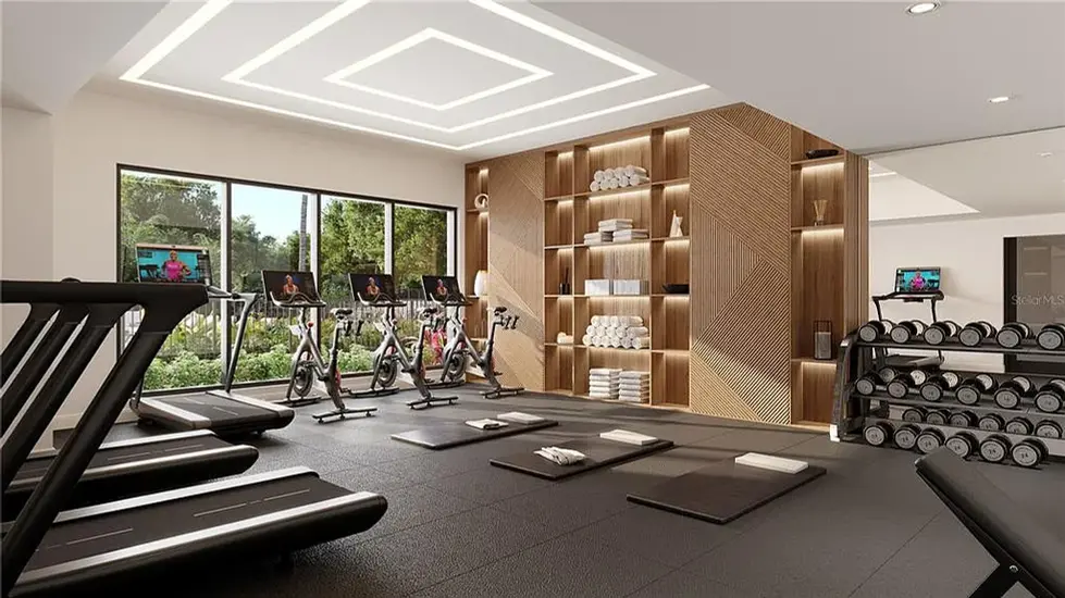 Akoya Luxury Condo in Sarasota. Modern gym with treadmills, bikes, and weights.