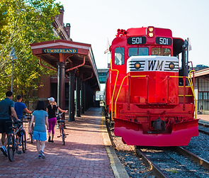 Cyclists in front of Western Maryland Scenic Railroadat the Western Maryland train station Canal Place, Cumberland, MD