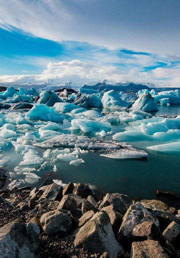 Stunning glacial lagoon in Iceland: icebergs floating on calm water