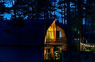 Illuminated cabin at night, VoyageVista