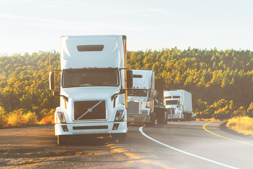 White semi-trucks on highway