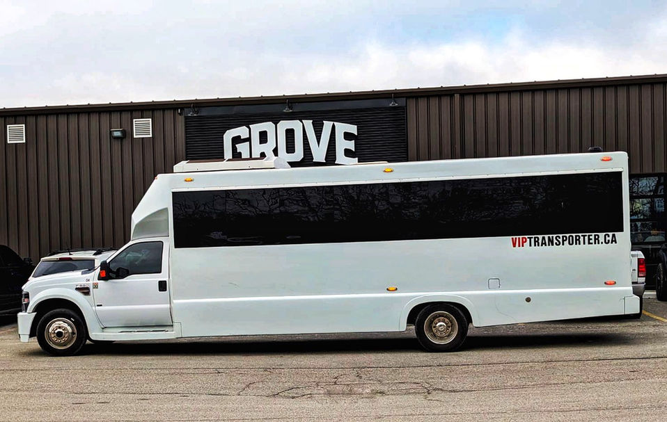 White limo party bus in front of Grove brewery