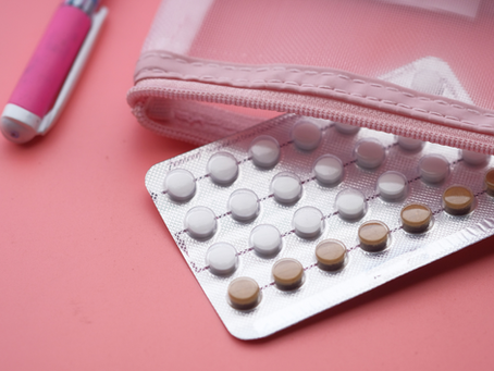 This is a close-up of birth control pills in a pink case symbolizing hormonal contraception and its effect on menstrual cycles, with care available from Miami Women’s Center gynecologists in Miami
