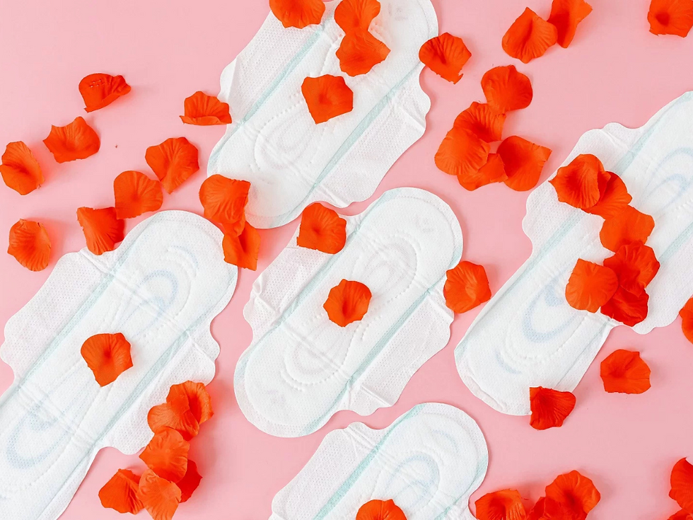 This is an image of pads with flower petals to represent menstruation, period irregularities, and women’s reproductive wellness, with care available from Miami gynecologists at Miami Women’s Center
