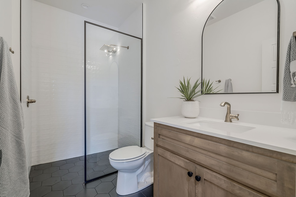 House of Rad Modern Farmhouse Bathroom Stained Wood Cabinets Black Hexagon Tile Black Framed Shower