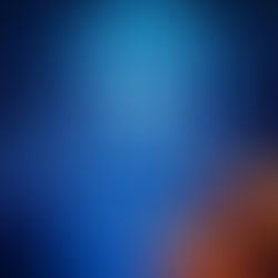Neon blue "X" glows in a digital landscape with a brain graphic in the background. Orange sparks create dynamic energy, sci-fi vibe.