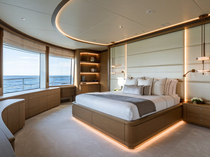 Modern yacht bedroom with ocean views and built-in furniture