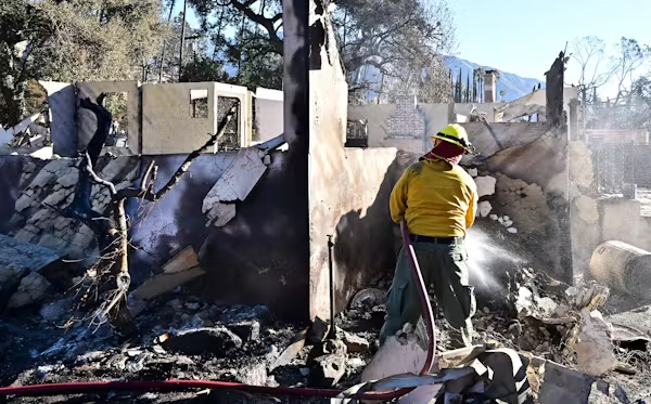 A firefighter from Idaho sprays down the rubble of homes demolished by the Eaton Fire in Altadena, Calif., on Jan. 15, 2025. Photo by Frederic J. Brown/AFP via Getty Images