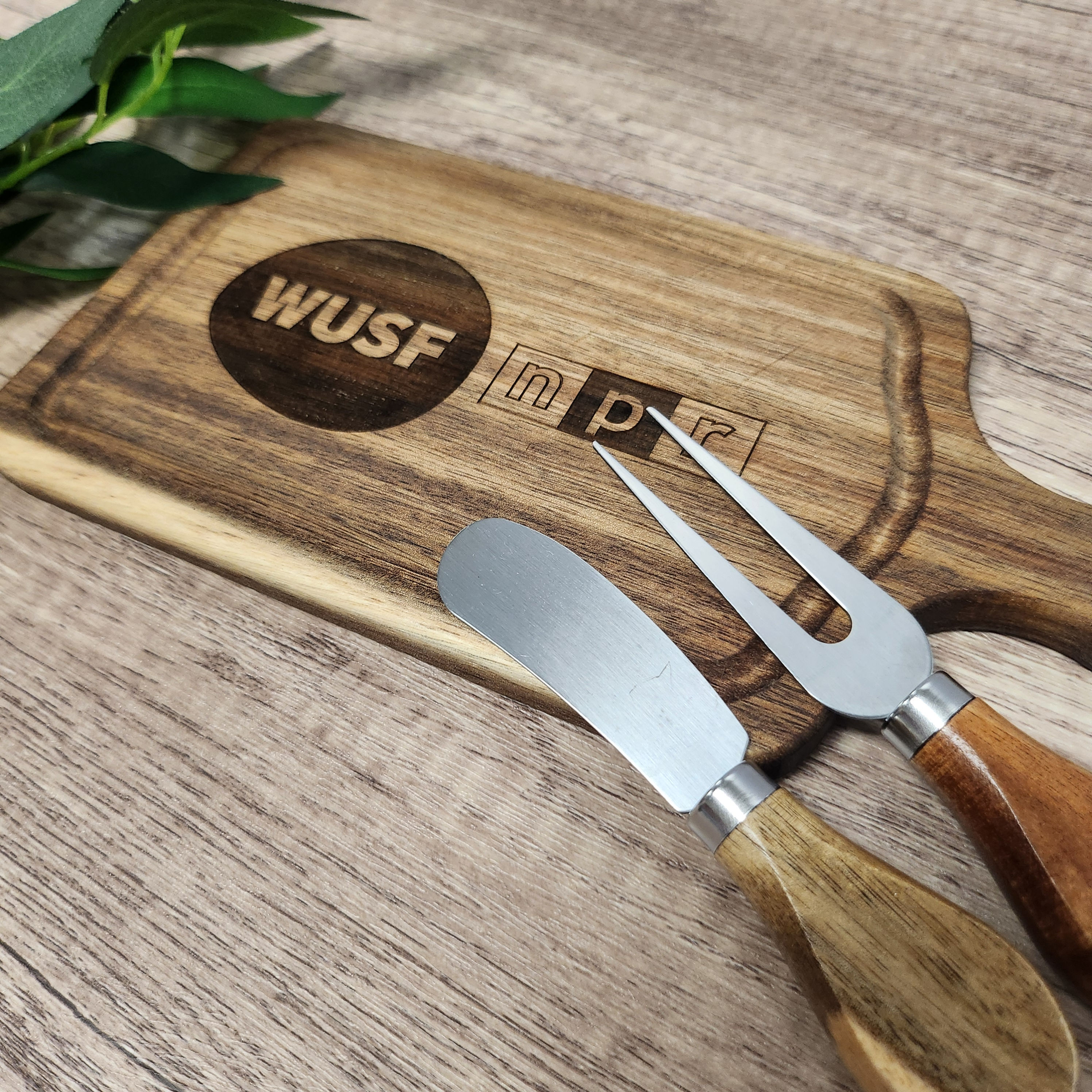 An engraved cheese board set