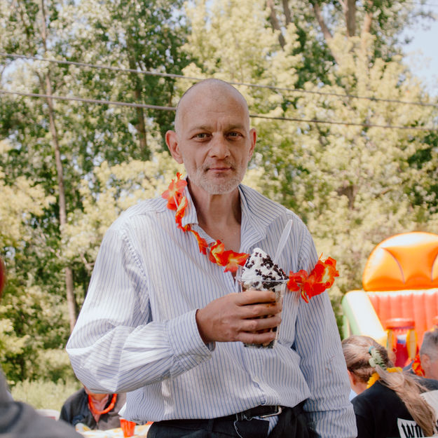 A member of Liberties Inc. proudly shows off his ice cream from Swirly Top Ice Cream Shop in New Baltimore, Michigan