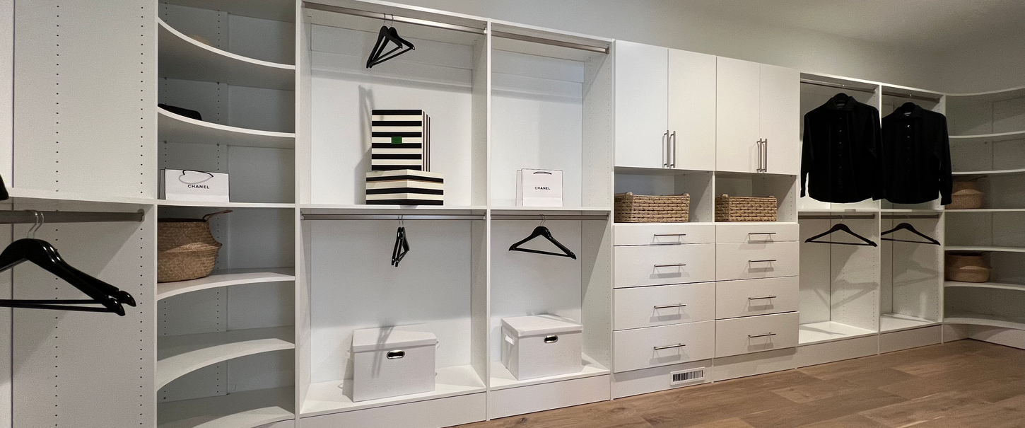 spacious-white-cabinet-shelving-hardwood-floor-master-closet-design-nu-way-kitchen-bath-rochester-hills