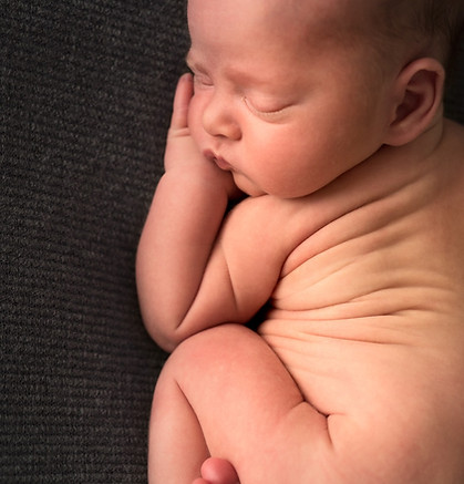 Close-up macro photograph showing a newborn baby's delicate skin folds during a Noosa lifestyle photography session.