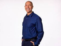 Photo of author Torrey Maldonado standing in front of a white background.