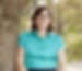 Photo of author Jennifer Swanson leaning against the trunk of a tree.