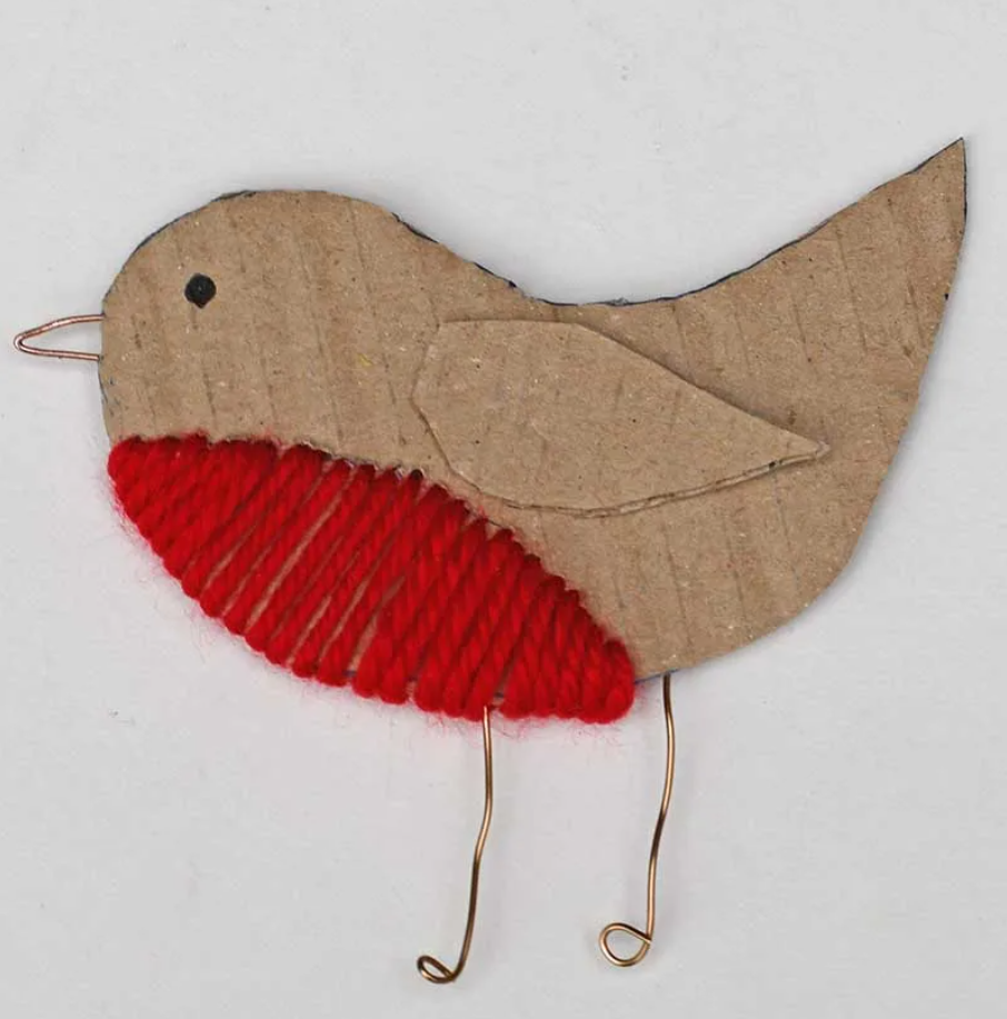 Photo of a carboard, yarn, and metal Robin craft.