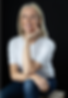 Photo of Deirdre Laide against a black background.