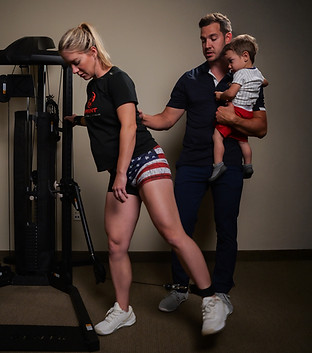 Mother practicing chiropractic-recommended exercises for postpartum posture and strength