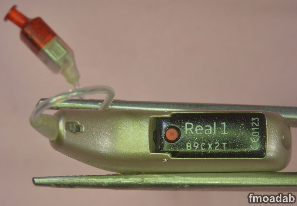 Thumbnail: pair of Oticon Real1 T RIC digital hearing aids iPhone compatible