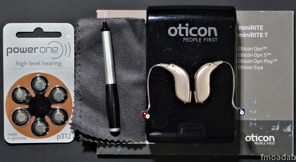 A pair of Oticon SAIYA2 digital BTE hearing aids iPhone compatible