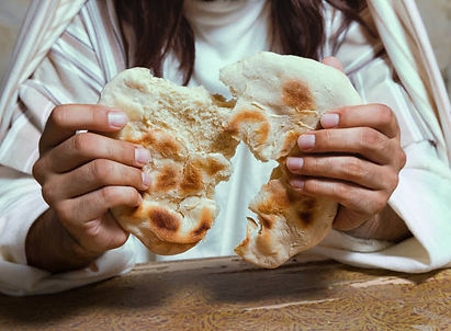 Jesus breaks bread for apostles.jpg