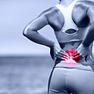 Back pain 1. Athletic running woman with back injury in sportswear rubbing touching lower
