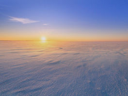 sunrise over a tundra landscape