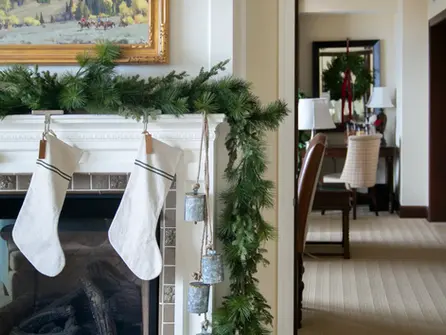 Studio McGee Santa Suite with garland and two stockings hanging at Montage Deer Valley