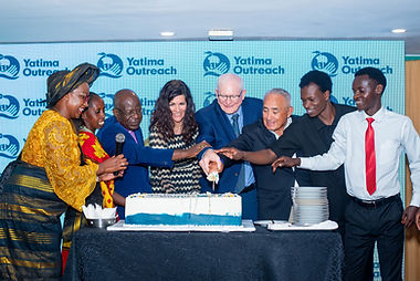 Mike Douris and Amy Norton cutting the celebration cake June 2025.jpg