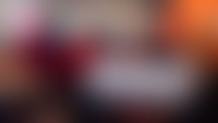 A group of people with Santa in the middle holding a check made out for $1,500 to ANGELS Outreach