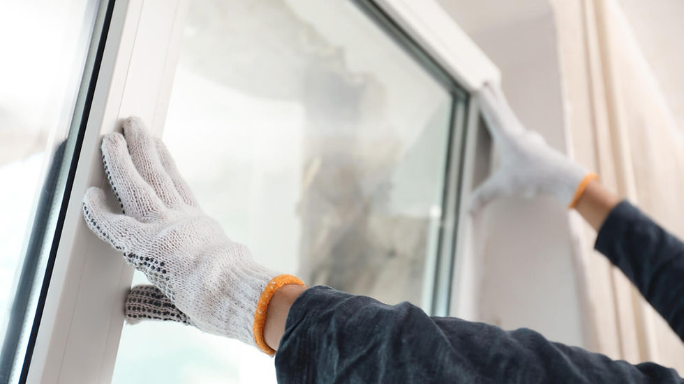 Person installing a window wearing white gloves, window installation services around