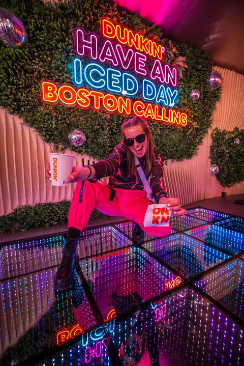 Guests Refuel and party inside the two-story House of Dunkin’ pop-up at Tortuga, Lollapalooza, and Boston Calling featuring a Dunkin’ café downstairs and an upstairs lounge-meets-club.