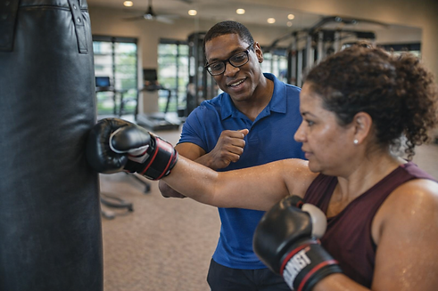 Carlos Duncan Personal Trainer Granary Flat Harvest Green Training Client On Punching Bag