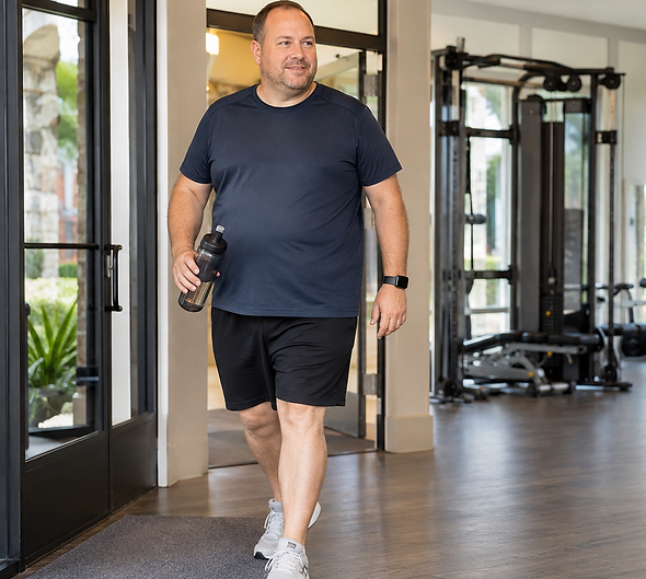 middle aged white man walking into long meadow farms fitness center to meet for personal t