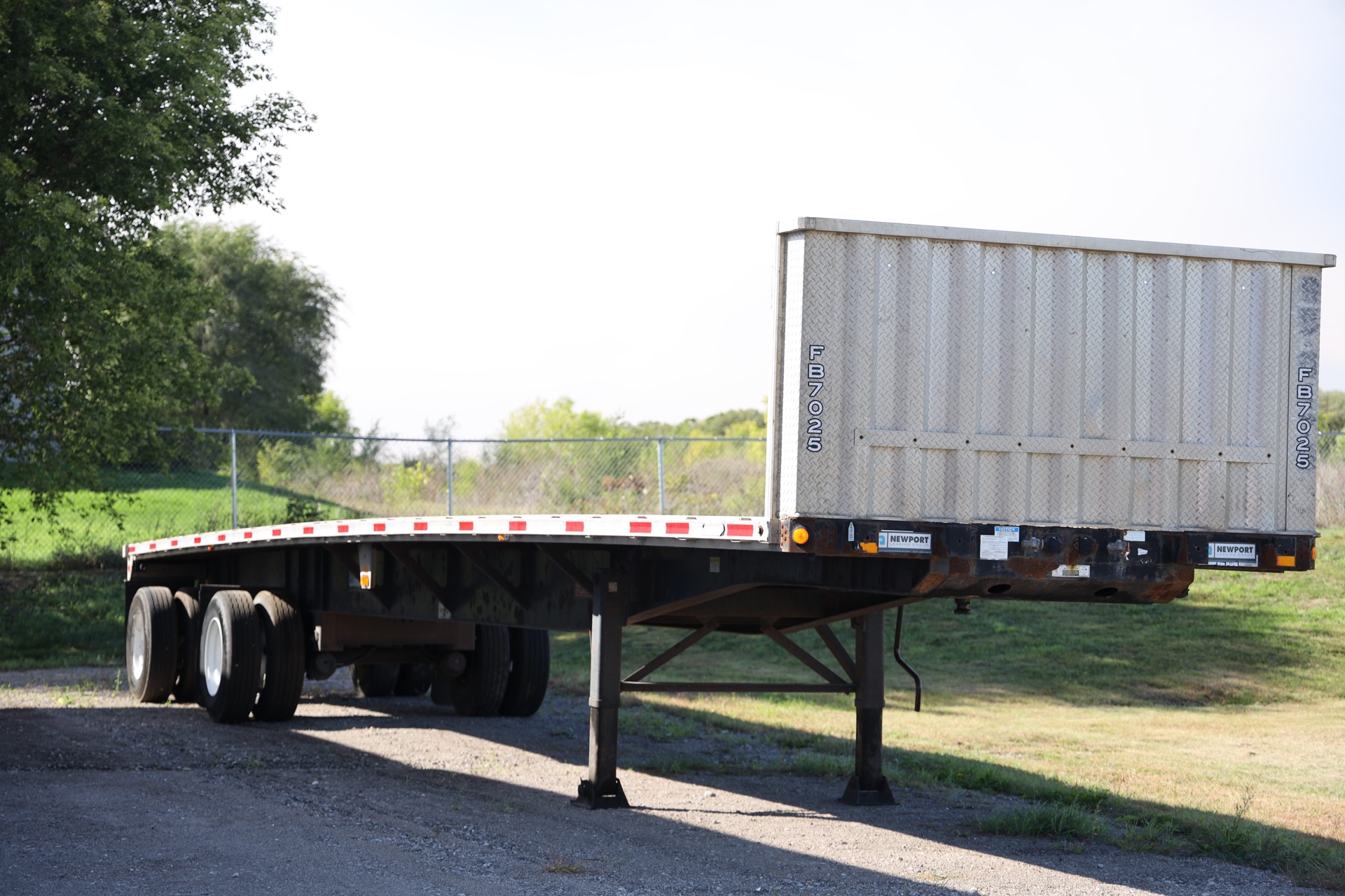 2005 Fontaine 48-foot spread-axle flatbed with bulkhead at Newport Leasing Group