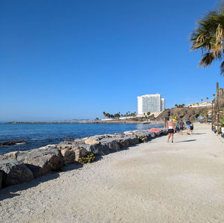 View of the hotel from the beach, by Kim