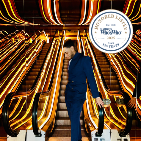 Fashion designer Sylvian Hyde celebrates inclusion into "Marquis Who's Who in America" wearing his signature winged cut double breasted Lamanai suit