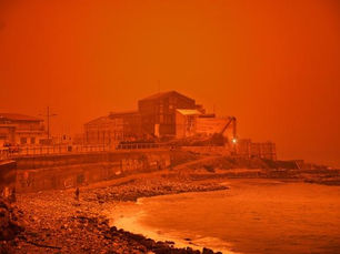 Red sky over Greece caused by Saharan dust storm, turning the atmosphere deep orange and illustrating light scattering in Earth’s atmosphere