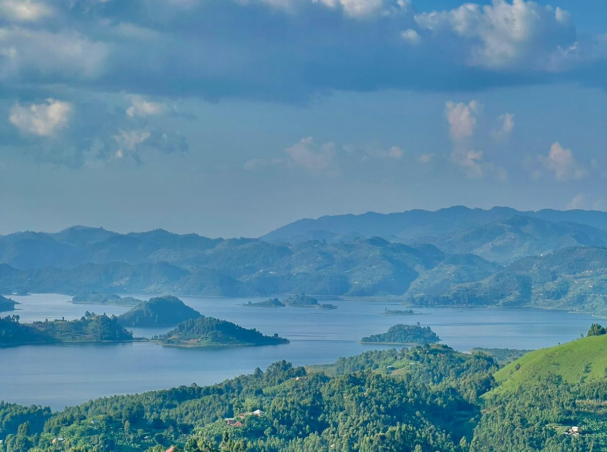 Wide-angle view of Lake Bunyonyi with terraced hills after a Bwindi road journey.