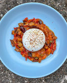 Creamy burrata cheese with vibrant caponata